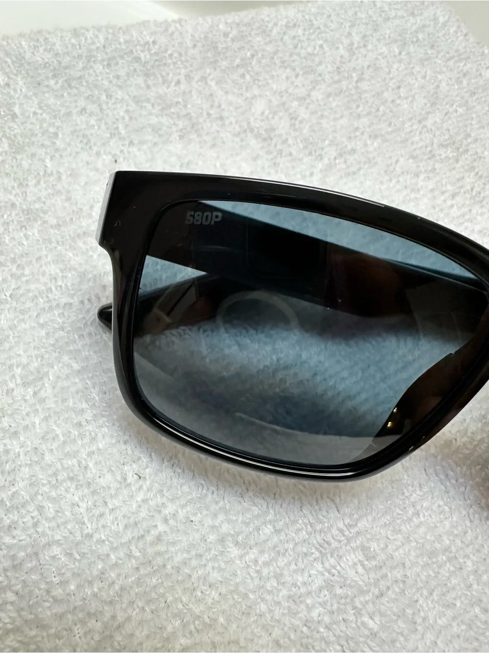 Costa Del Mar Paunch 580P Black Frame Sunglasses with Blue Lenses